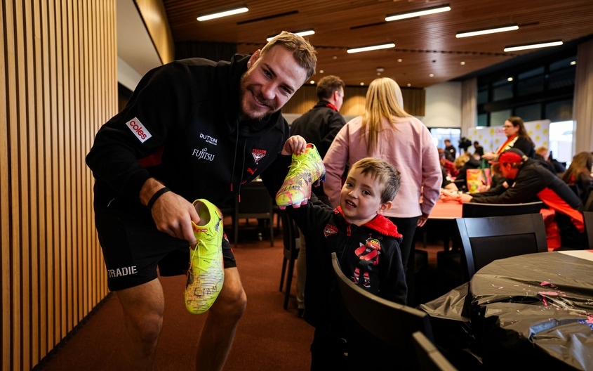 Images from Essendon's boot painting session with Challenge. (Photo: Essendon FC)