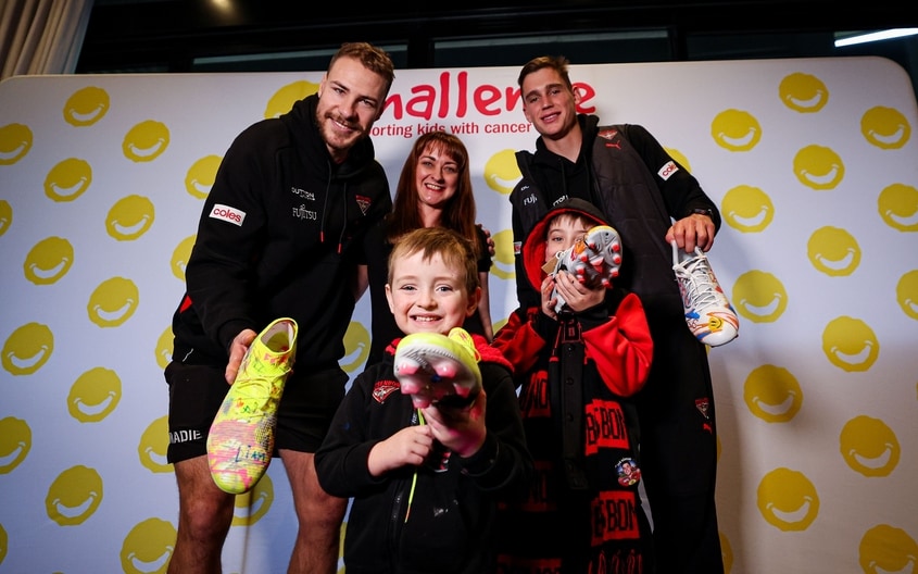 Images from Essendon's boot painting session with Challenge. (Photo: Essendon FC)