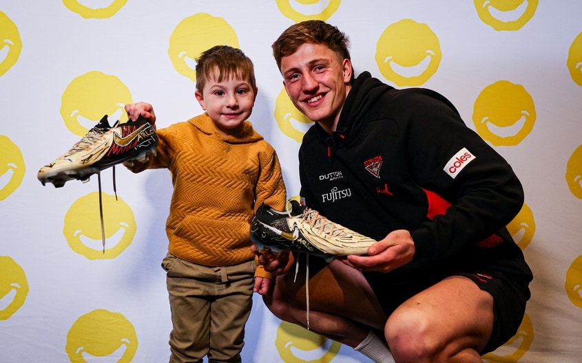 Images from Essendon's boot painting session with Challenge. (Photo: Essendon FC)