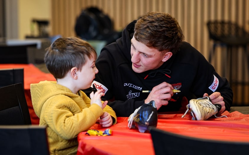 Images from Essendon's boot painting session with Challenge. (Photo: Essendon FC)