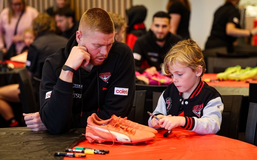 Images from Essendon's boot painting session with Challenge. (Photo: Essendon FC)