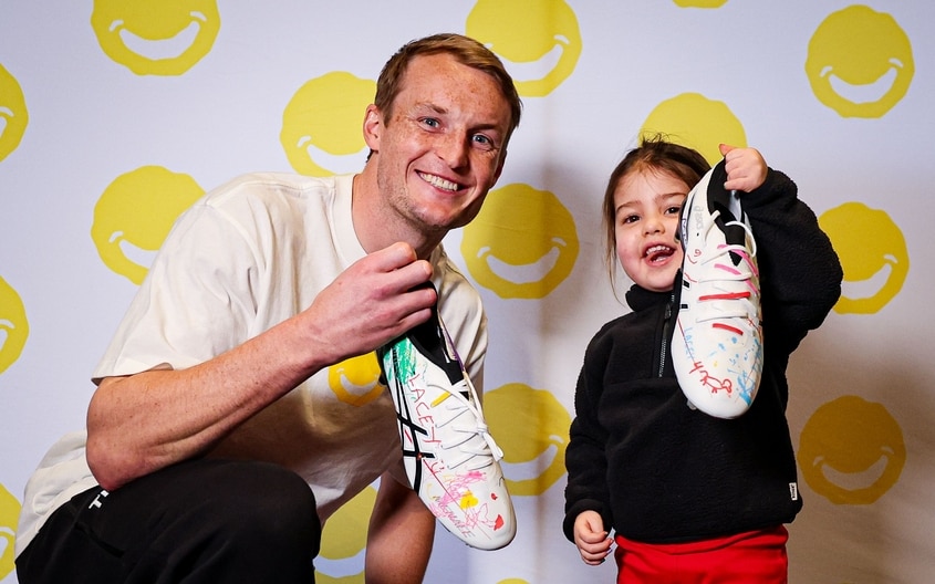 Images from Essendon's boot painting session with Challenge. (Photo: Essendon FC)