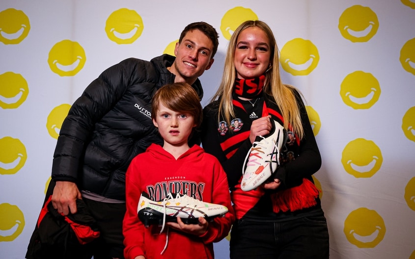 Images from Essendon's boot painting session with Challenge. (Photo: Essendon FC)