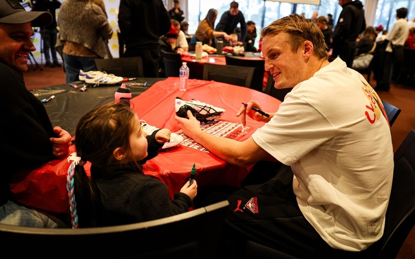 Images from Essendon's boot painting session with Challenge. (Photo: Essendon FC)