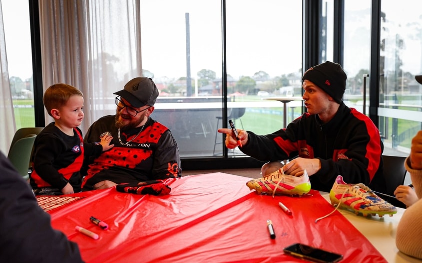 Images from Essendon's boot painting session with Challenge. (Photo: Essendon FC)