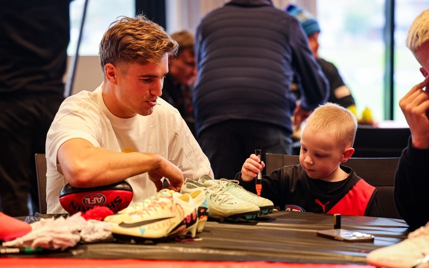 Images from Essendon's boot painting session with Challenge. (Photo: Essendon FC)