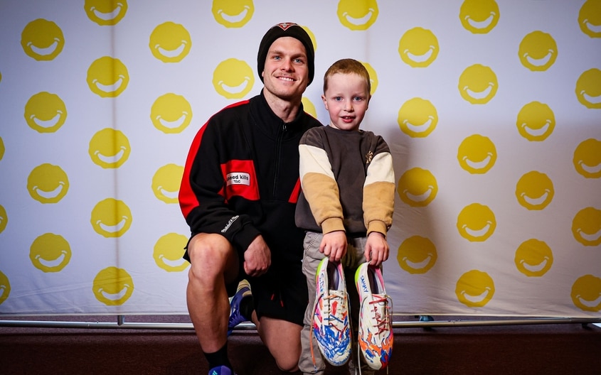 Images from Essendon's boot painting session with Challenge. (Photo: Essendon FC)