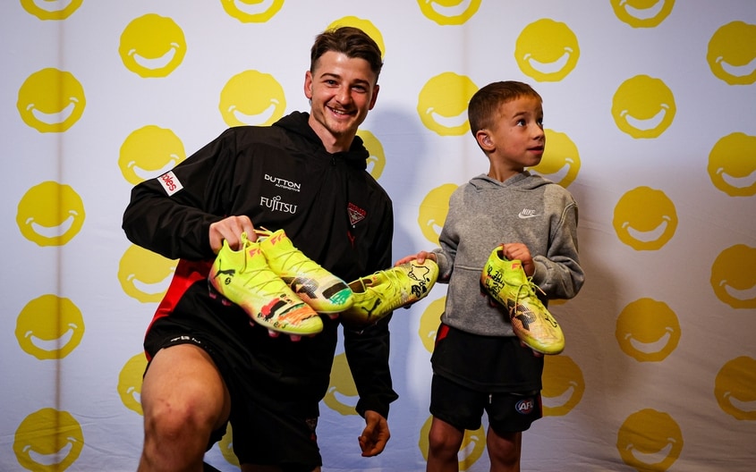 Images from Essendon's boot painting session with Challenge. (Photo: Essendon FC)
