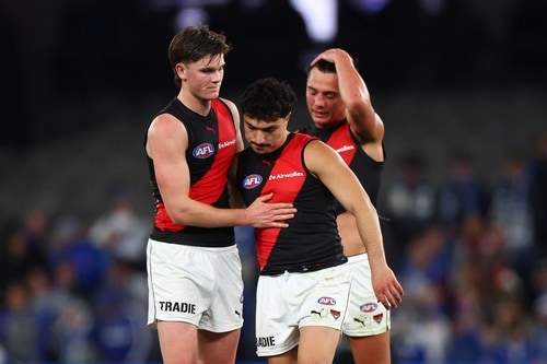Essendon players compete against North Melbourne at Marvel Stadium